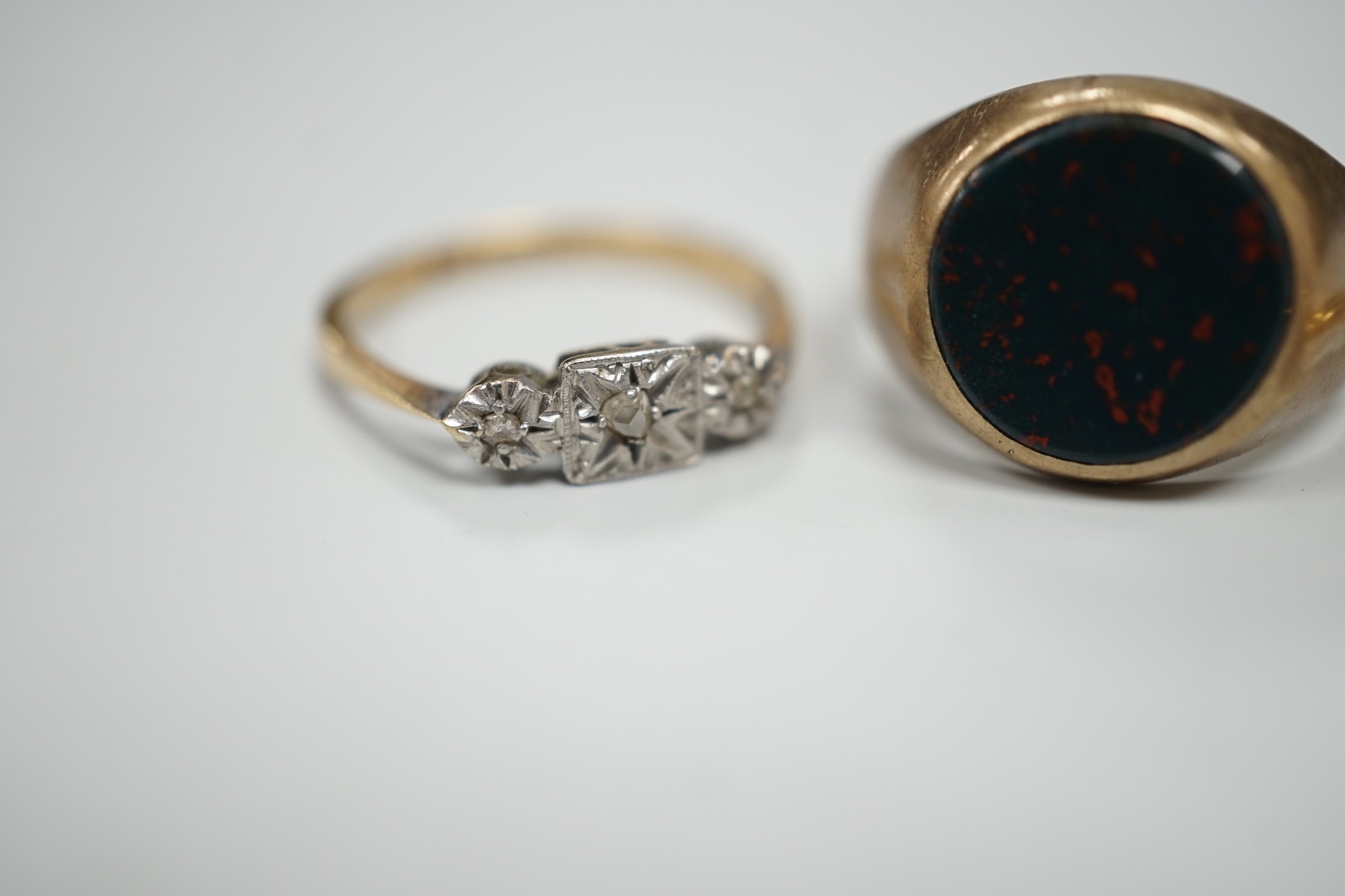 A 1920's 18ct and diamond chip set cluster ring, size N, gross 2.4 grams and two 9ct rings including bloodstone set signet, gross 7.2 grams.